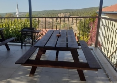 terrace with garden views and an outdoor dining area with barbeque (gas)